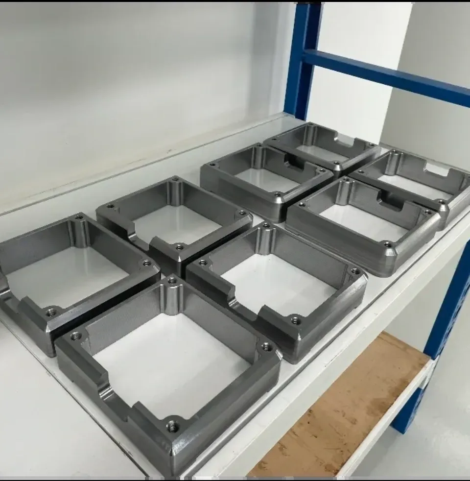 Batch of CNC milled aluminium housings on stainless bench