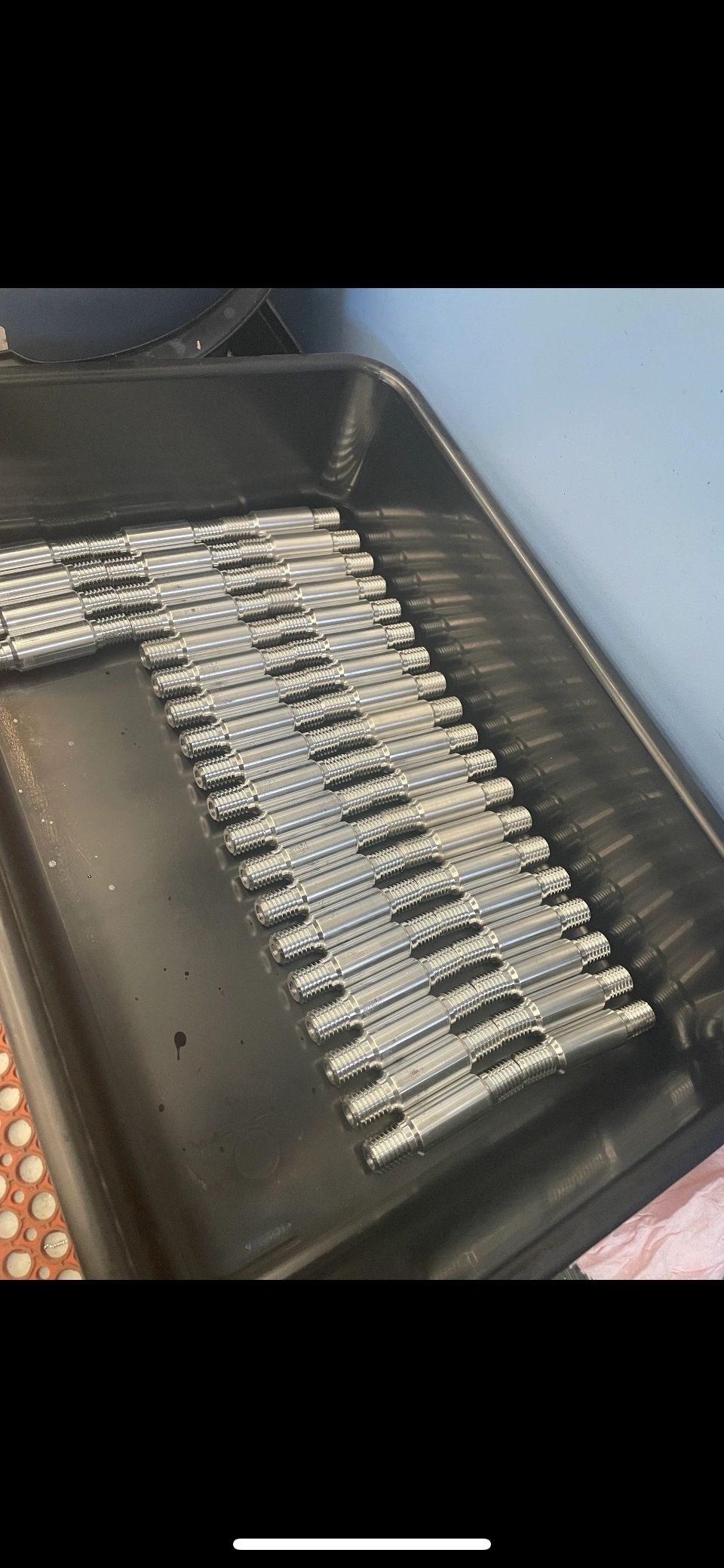 Tray of machined threaded studs, production run Padco Engineering