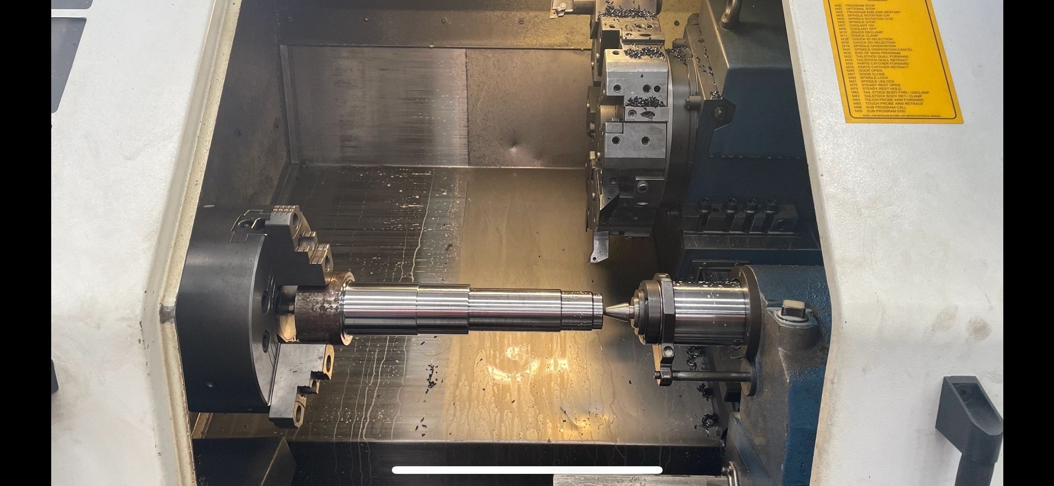 CNC lathe with long splined shaft chucked, Padco Engineering workshop