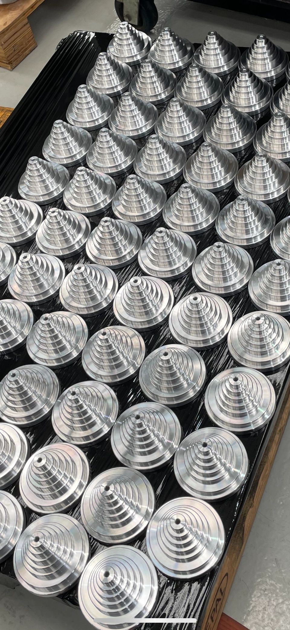 Batch of spiral-finish aluminium discs, precision CNC turning