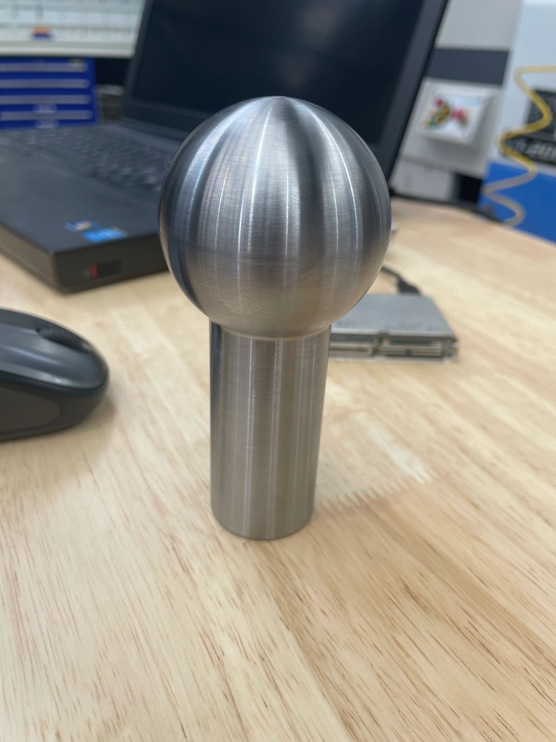 Highly polished spherical turned component, precision lathe work Padco Engineering