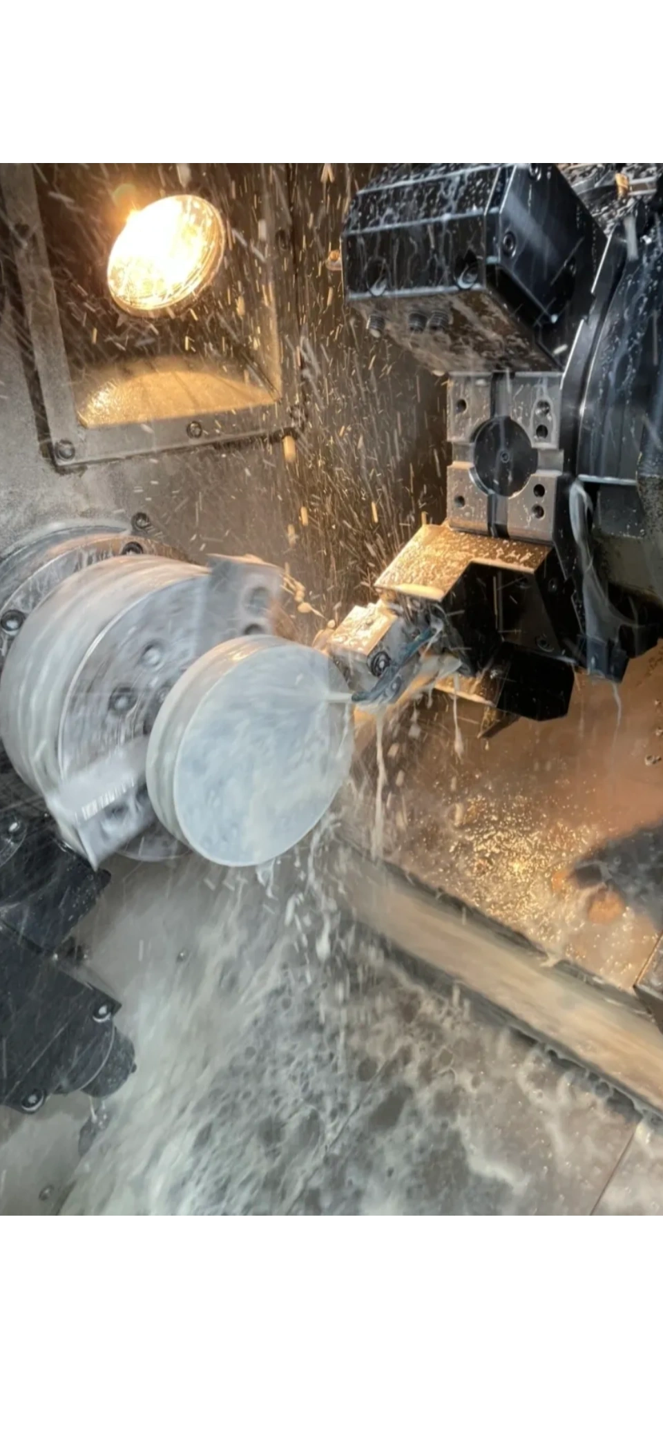 CNC lathe in action with coolant spray, Padco Engineering Pakenham VIC