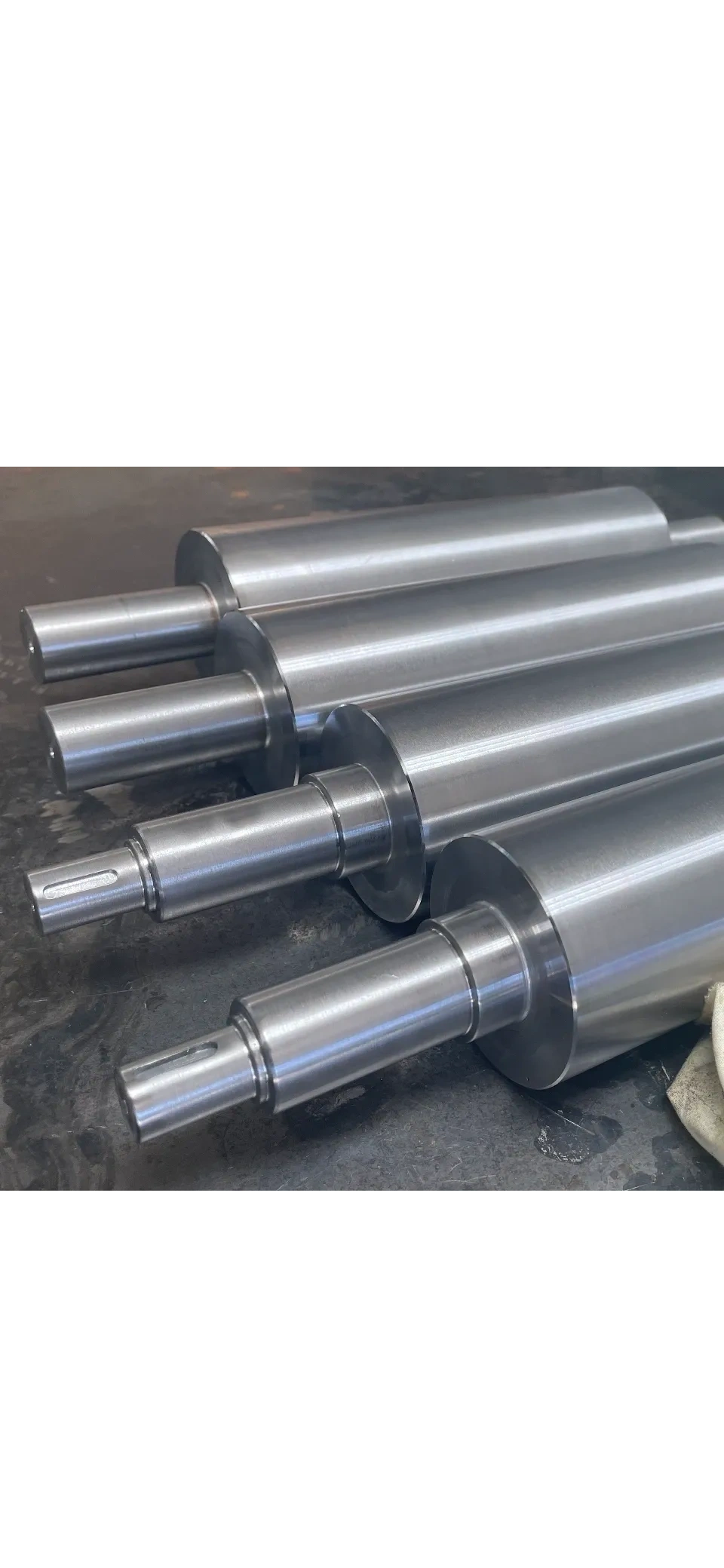 Large diameter polished steel shafts and rollers, manual turning Padco Engineering