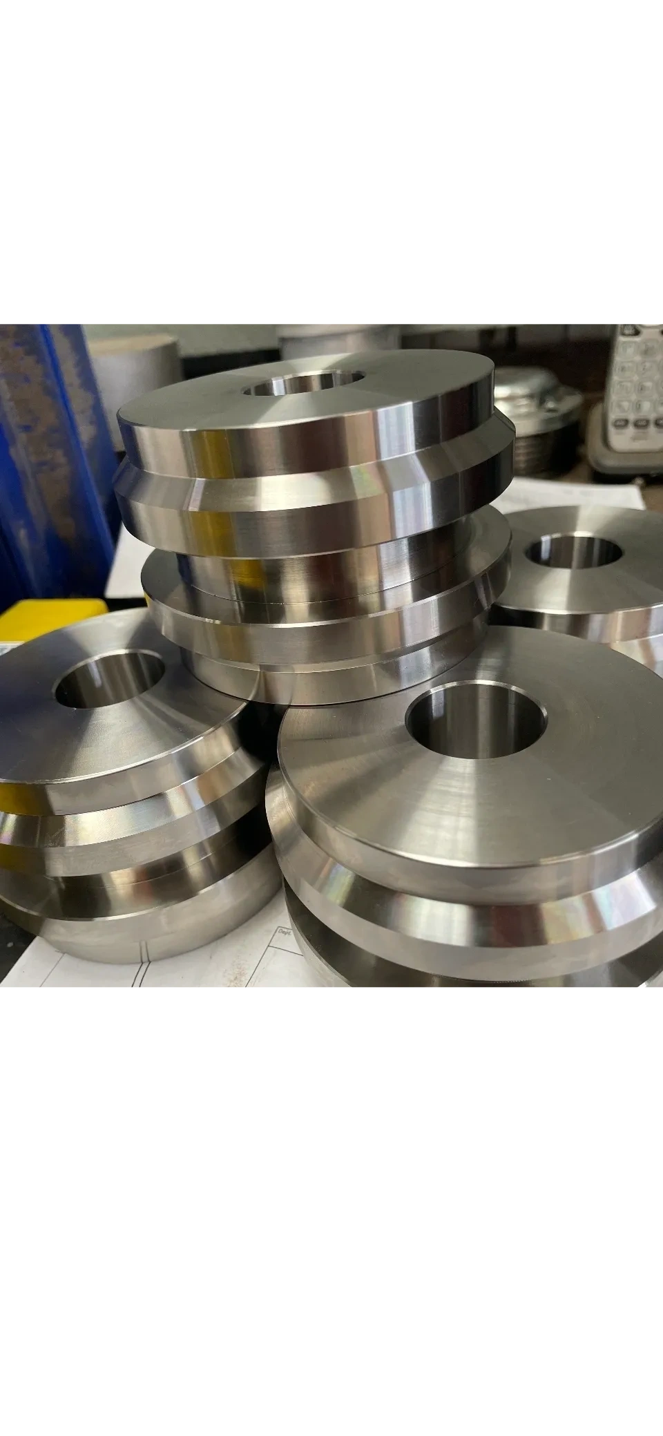 Stack of large stepped steel flanges with central bore