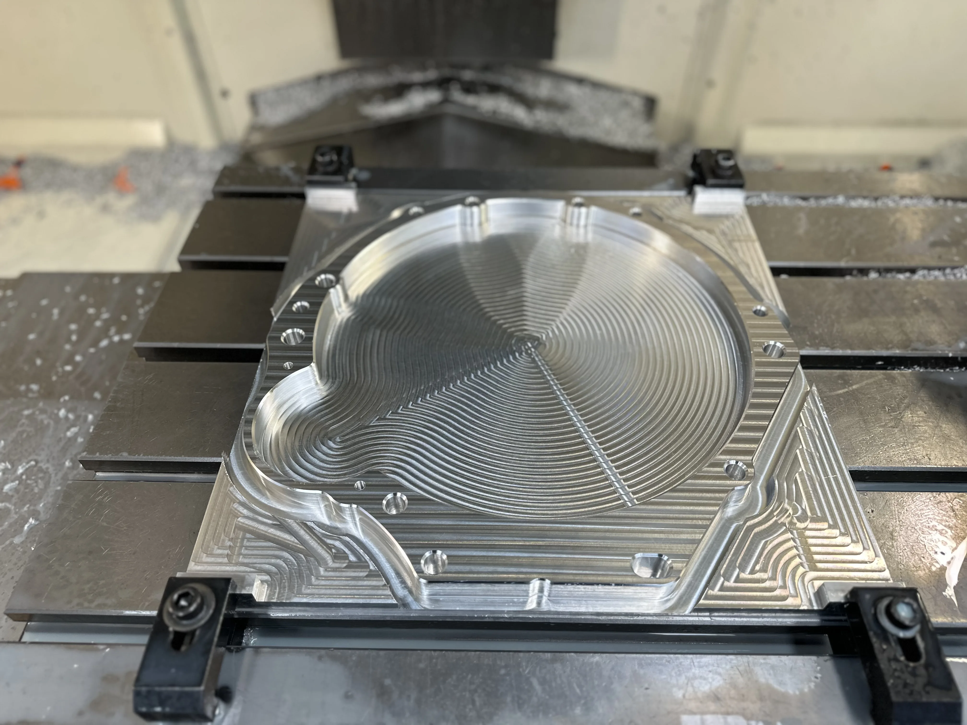 Large aluminium plate with CNC milled circular pocket — radial CAM toolpath, Padco Engineering