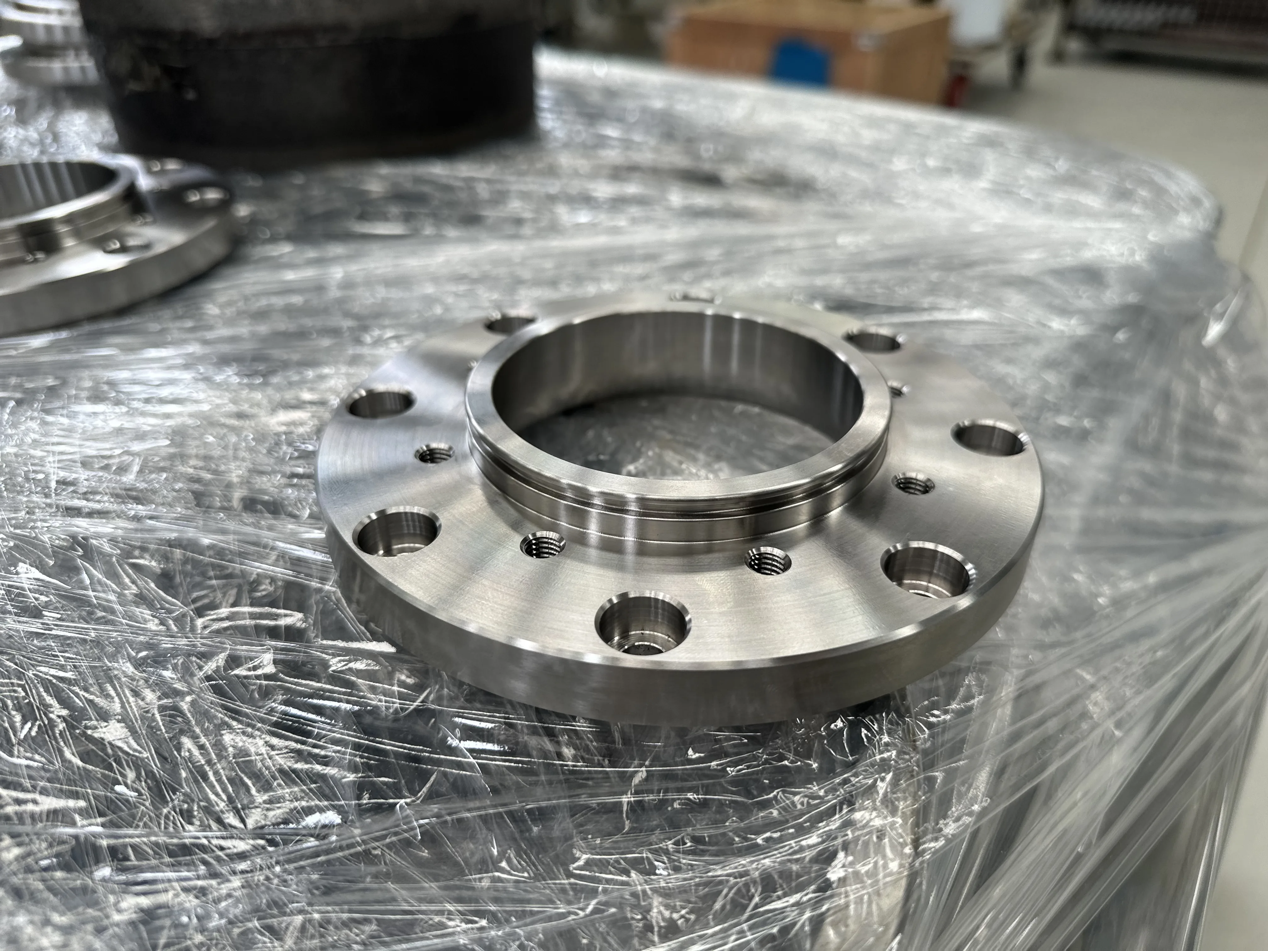 Precision stainless steel flange — close-up detail, Padco Engineering