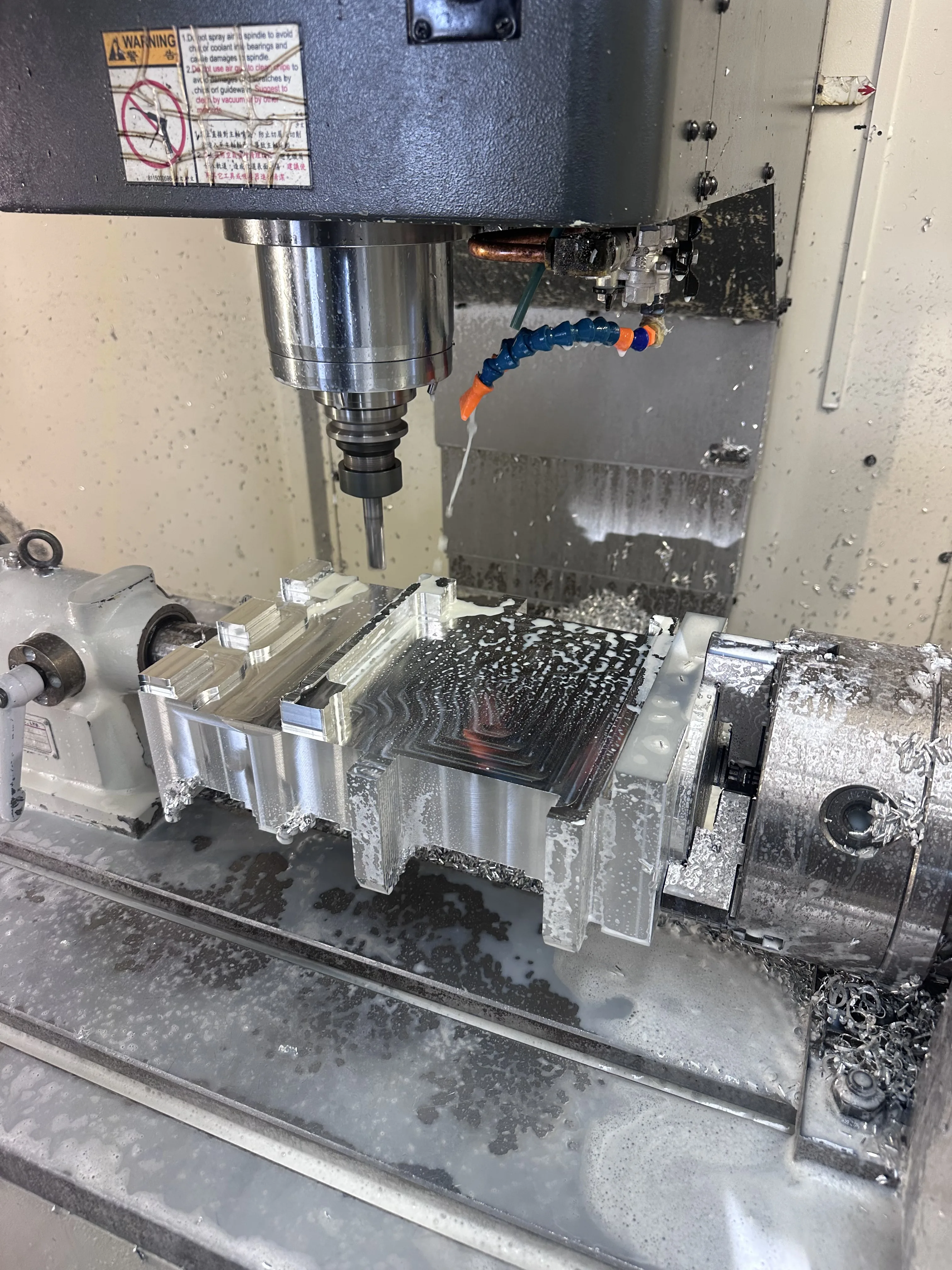 CNC machining centre milling aluminium in 4th-axis rotary fixture, Padco Engineering