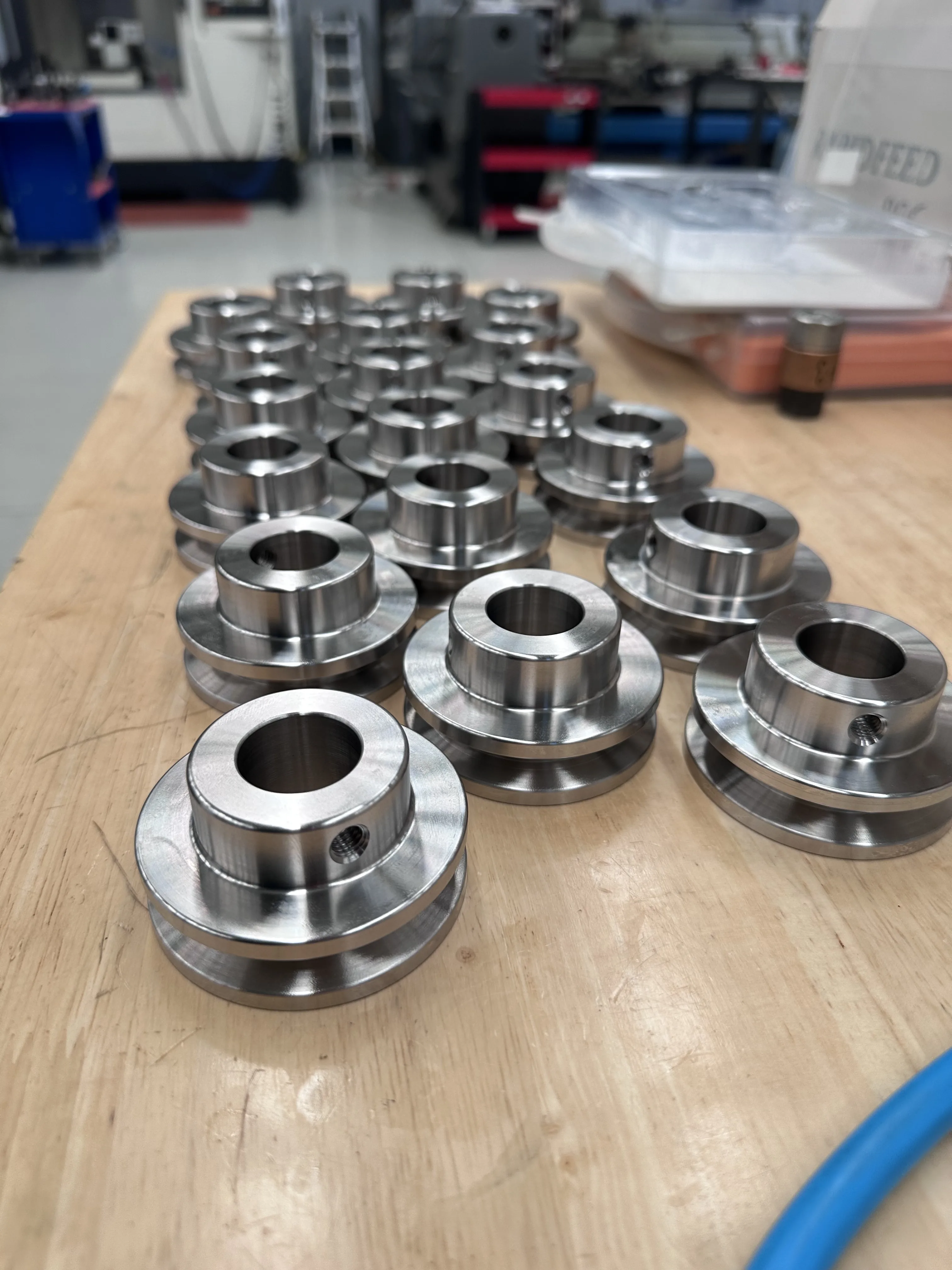 Production batch of stainless V-belt pulleys and shaft collars, Padco Engineering